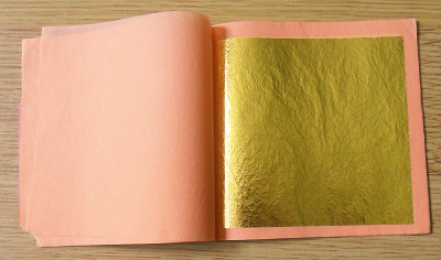 A book of standard 80mm sqare gold leaf. 25 sheets in a book, loose, separated with tissue paper. Copyright ©2020 Paul Alan Grosse.