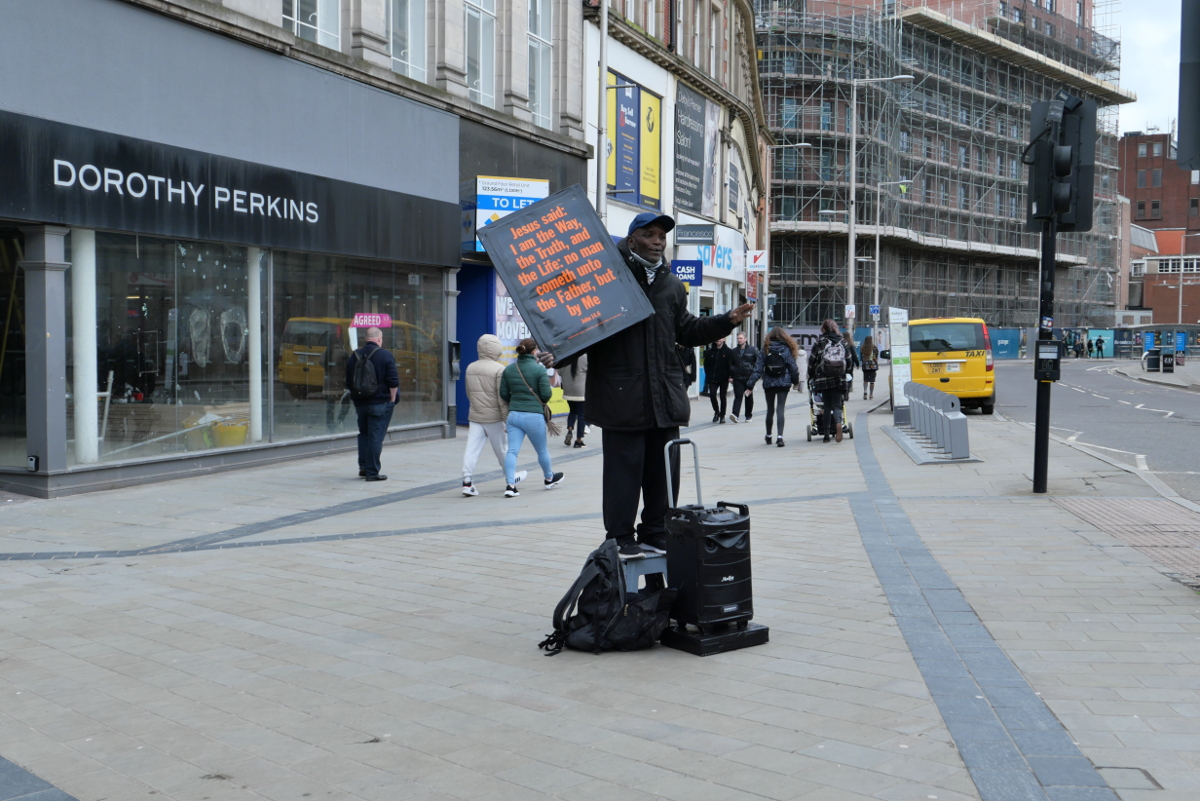 Derby: City Centre - Preacher just playing loud music - no voice of his own or an instrument. Post-skills preaching. 20230401 Copyright (c)2023 Paul Alan Grosse. All Rights Reserved.
