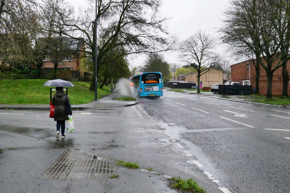 Derby: Sinfin Bus sprerayingg a puddle 20230414 Copyright (c)2023 Paul Alan Grosse. All Rights Reserved.