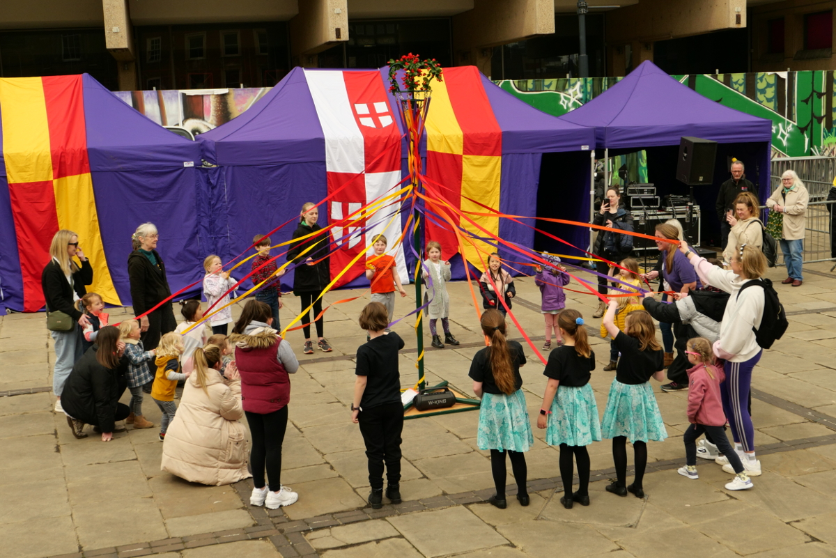 Derby: Saint George's Day 2023. Market Square Kids around the Maypole Copyright (c)2023 Paul Alan Grosse. All Rights Reserved.