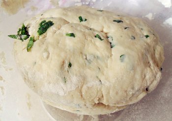Just white bread dough with chopped coriander leaf. 1