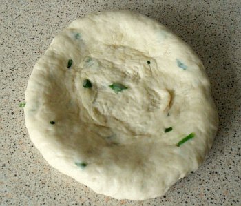 Take a small piece of dough (5cm diameter ball).