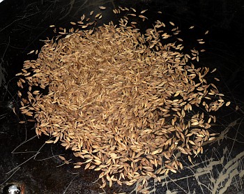 Dry-roast jeera on a dry tava.