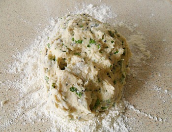 Dough, complete with onion seeds and chopped fresh coriander.