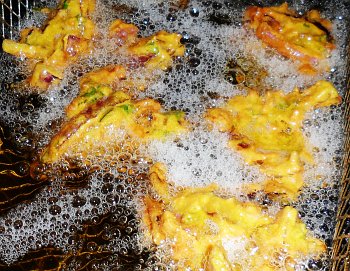 Onion bhaji frying in sunflower oil