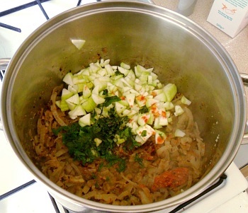 Onions, chillies, spices, all cooked, with the torai on top, ready to steam.