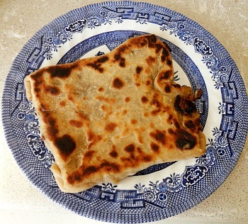 One nice, stuffed paratha, ready to eat.