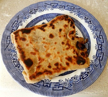 One nice, stuffed paratha, ready to eat.