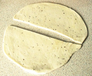 Roll out the dough to around 2-3mm thick and slice in half.