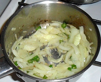 Chillies and onions - add the ginger and garlic.