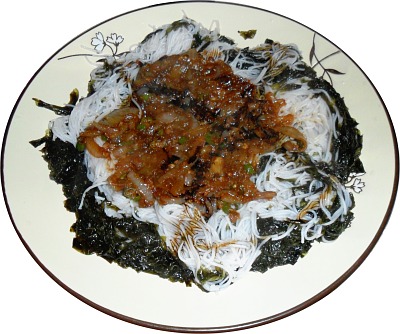 Our spicy sauce on a bed of rice noodles and seaweed.