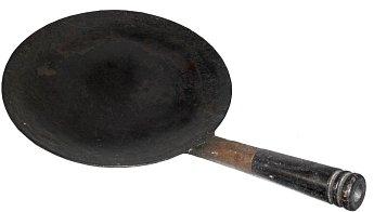 Tava - a small, slightly curved griddle for making roti.